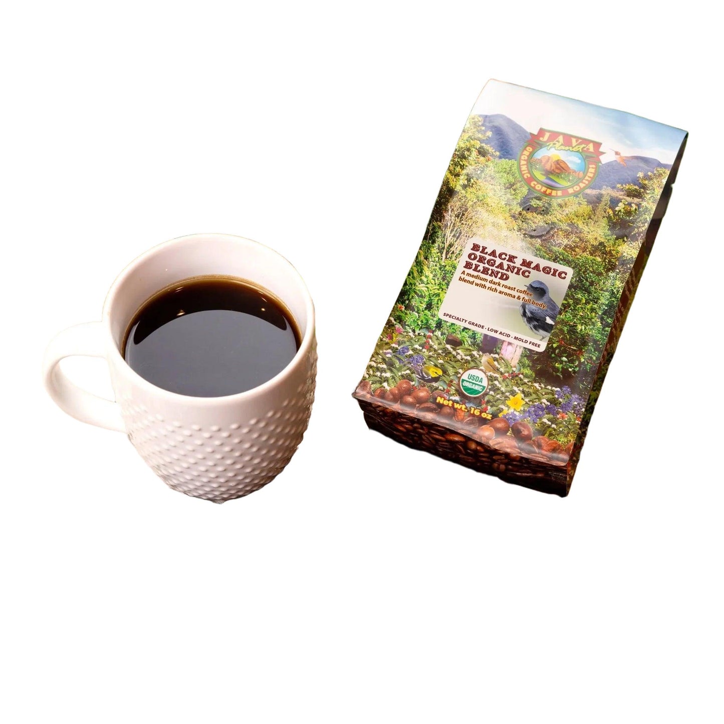 Black Magic Organic Blend coffee beans, white mug, and coffee bag on natural leaves, coffeefetch.com